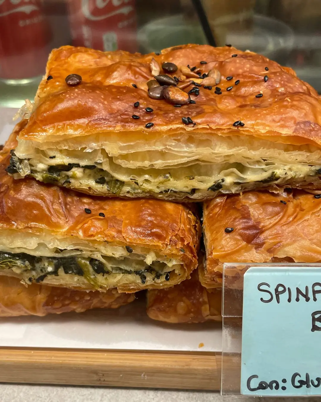 A slice of savoury Turkish borek with a flaky golden crust.
